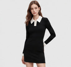 Black mini dress with a contrasting white collar, worn by a model