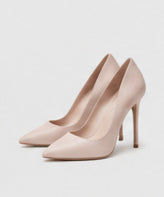 A pair of nude pointed-toe high-heel pumps